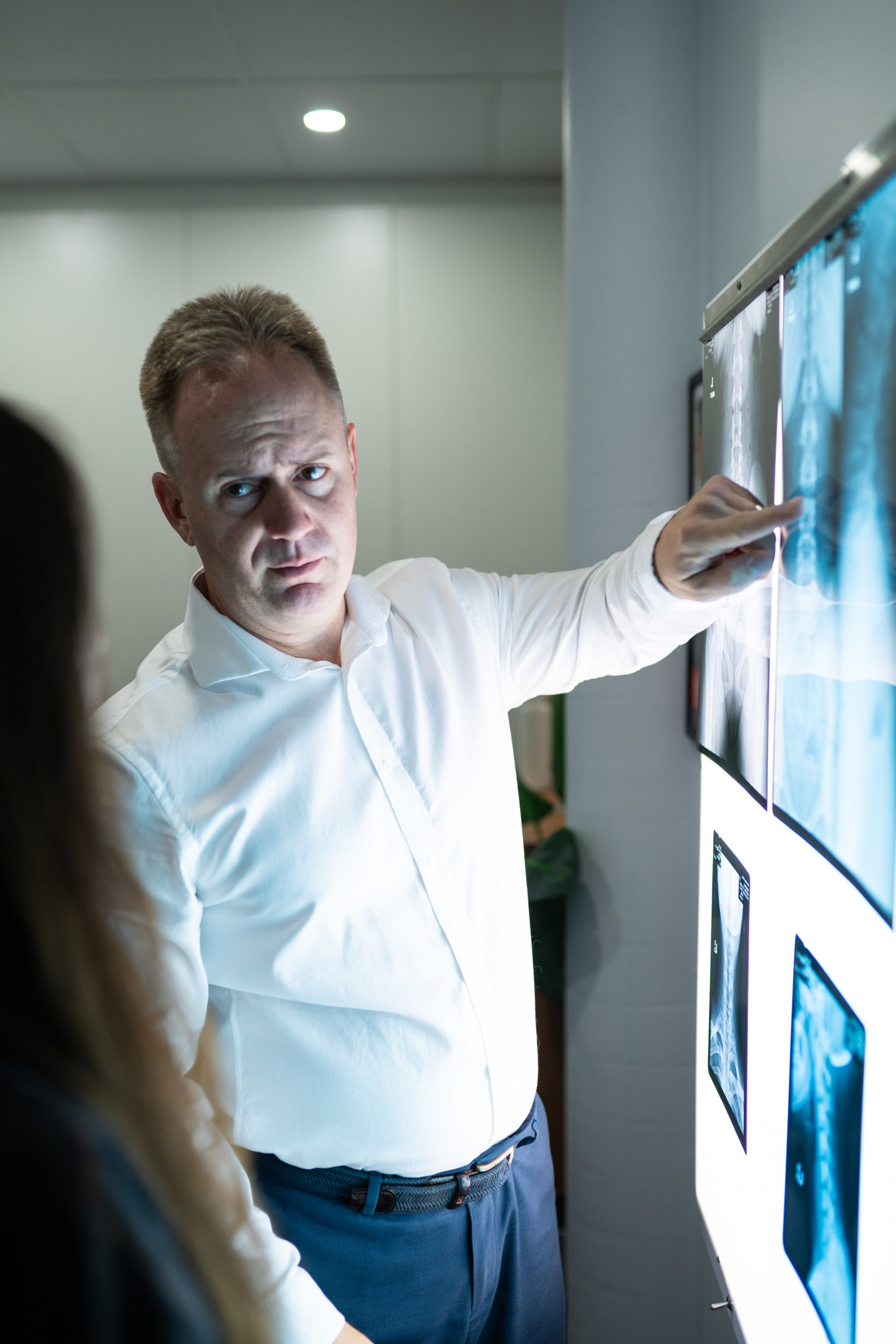 Dr Mark Whitfield reviewing patient x-rays at Corrective Chiropractic Calamvale